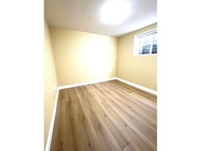 Surrey apartment for rent - A room with wooden flooring and a window.