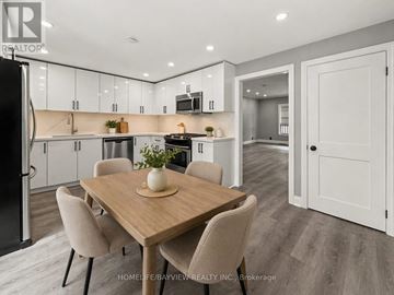 Hamilton (North End) apartment for rent - A modern kitchen with a dining table and chairs.
