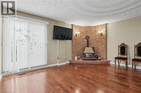 Hamilton apartment for rent - A living room with a fireplace and a flat screen TV.
