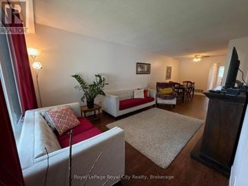 Cambridge apartment for rent - A living room with a red couch and a white sofa.