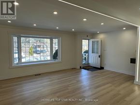 Richmond Hill (Crosby) apartment for rent - A room with wooden flooring and a large window.