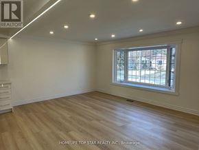 Richmond Hill (Crosby) apartment for rent - A room with a window and wooden flooring.