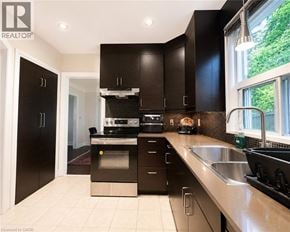 Hamilton apartment for rent - A modern kitchen with black cabinets and stainless steel appliances.