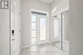 Ottawa townhouse for rent - A white room with a door and a window.