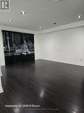 Toronto (Eglinton East) townhouse for rent - A room with wooden floors and a wall mural of a zebra.