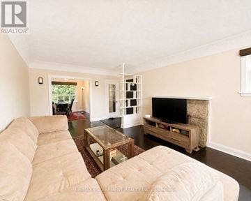 Hamilton (Westcliffe) apartment for rent - A living room with a beige couch and a glass coffee table.
