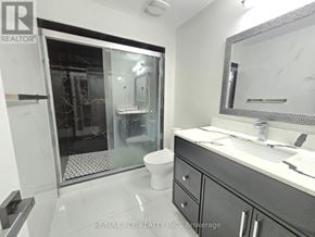 Oshawa (Taunton) apartment for rent - A bathroom with a toilet, sink, and shower.