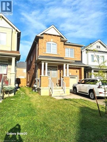 Niagara Falls apartment for rent - A house with a white car parked in front.