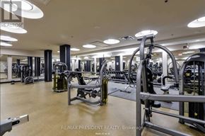 Mississauga (City Centre) condo for rent - A gym with a variety of equipment including a leg press machine.
