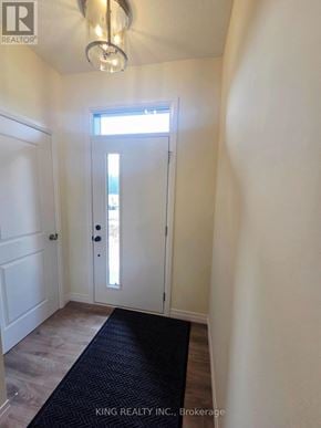 London South (South V) townhouse for rent - A hallway with a door leading to a balcony.