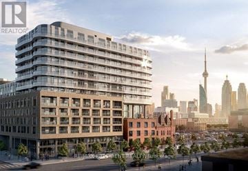 Toronto (Waterfront Communities) condo for rent - A modern multi-story building with a glass facade is the main focus of the image.