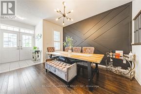 Hamilton (Binbrook) apartment for rent - A well-lit room with a wooden floor and a large window.