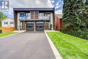 Mississauga (Lakeview) apartment for rent - A modern house with a large driveway in front.