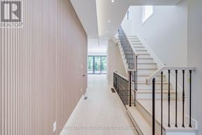 Mississauga (Lakeview) apartment for rent - A modern house with a balcony and a brown door.