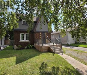 Niagara Falls (Dorchester) apartment for rent - A house with a brick exterior and a deck in front.