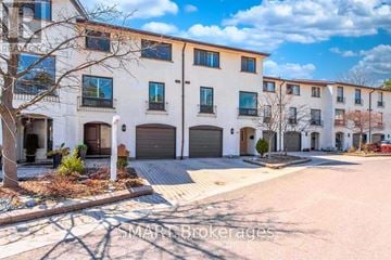 Mississauga (Meadowvale) townhouse for rent - A row of townhouses with the name "MART BROKERAGES" on the bottom left.