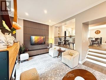 Mississauga (Meadowvale) townhouse for rent - A living room with a sofa, a chair, a table, and a painting on the wall.