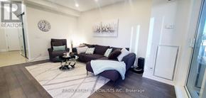 Toronto (Mimico) condo for rent - A living room with a couch, chair, and a coffee table.