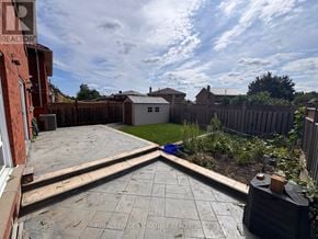 Toronto (West Humber-Clairville) apartment for rent - A backyard with a patio and a fence.