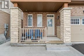 Brampton (Northwest Brampton) apartment for rent - A house entrance with a wooden porch and a white door.
