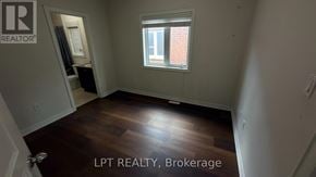 Brampton (Northwest Brampton) apartment for rent - A room with a window and wooden flooring is for sale.