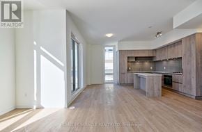 Richmond Hill townhouse for rent - A spacious, well-lit living room with wooden floors and modern furnishings.
