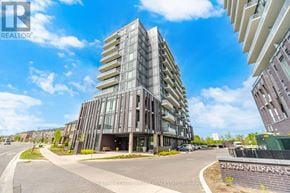 Brampton (Northwest Brampton) condo for rent - A modern multi-story building with a glass facade is the focal point of the image.