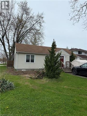 St. Catharines apartment for rent - A house with a tree in front of it.