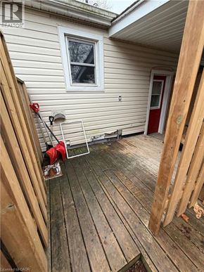 St. Catharines apartment for rent - A wooden deck with a red fire extinguisher on it.