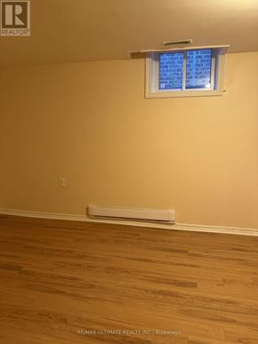 Brampton (Northwest Sandalwood Parkway) apartment for rent - A room with a window and a radiator on the floor.