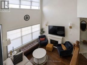 Oakville (Wt West Oak Trails) apartment for rent - A living room with a fireplace and a flat screen TV.