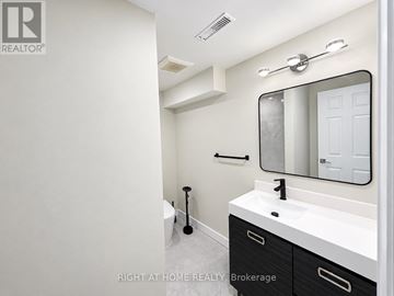 Markham (Thornhill) apartment for rent - A bathroom with a sink, mirror, and toilet.