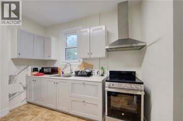 Hamilton apartment for rent - A kitchen with a stove and cabinets.