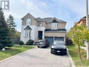 Richmond Hill (Rouge Woods) apartment for rent - A two-story house with a garage and a car parked in front.