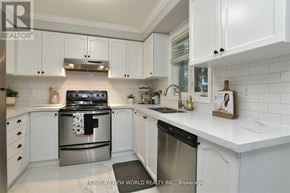 Bradford West Gwillimbury (Bradford) apartment for rent - A modern kitchen with white cabinets and stainless steel appliances.