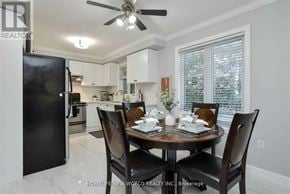 Bradford West Gwillimbury (Bradford) apartment for rent - A dining room with a table set for two and a black refrigerator.