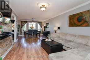 Bradford West Gwillimbury (Bradford) apartment for rent - A living room with a couch, a coffee table, and a painting on the wall.