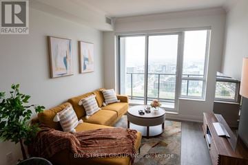 Markham (Unionville) condo for rent - A living room with a yellow couch and a coffee table.