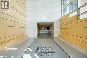 Burnaby apartment for rent - A hallway with the words "Solo District Altus" on the floor.