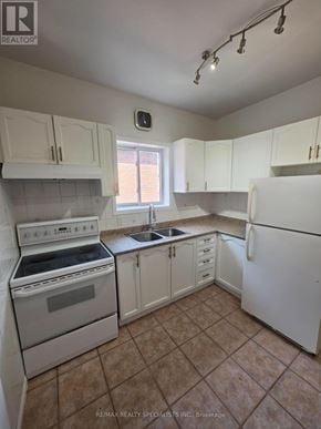 Hamilton (Landsdale) apartment for rent - A kitchen with white appliances and cabinets.