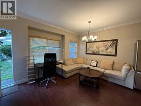 Burnaby apartment for rent - A living room with a couch, chair, and a painting on the wall.