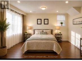 Vaughan (Patterson) apartment for rent - A bedroom with a large bed and two nightstands.