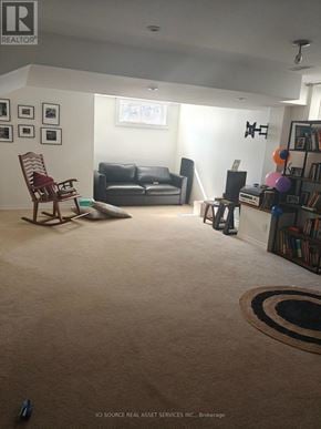 Ottawa apartment for rent - A living room with a couch, chair, and rug.