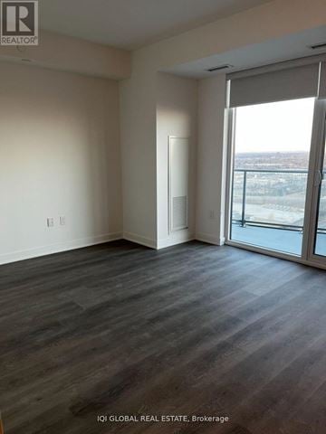Toronto (Islington-City Centre West) house for rent - A room with a sliding glass door leading to a balcony.