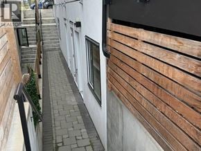 North Vancouver apartment for rent - A spacious room with wooden flooring and white walls.