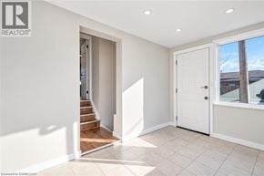 Hamilton apartment for rent - A room with a white door and a window with a view of the outside.