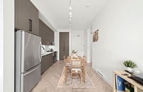 Surrey apartment for rent - A modern kitchen with a dining table set for two.