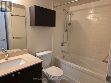 Markham (Unionville) condo for rent - A bathroom with a toilet, sink, and bathtub.