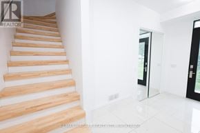 Welland (Lincoln/Crowland) townhouse for rent - A set of wooden stairs in a white room.