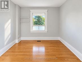 Toronto (Dovercourt-Wallace Emerson-Junction) apartment for rent - A room with a window and wooden flooring.